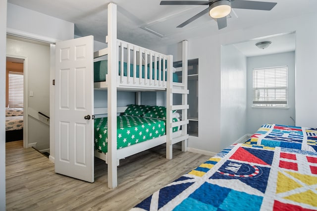 bedroom featuring wood-type flooring and ceiling fan