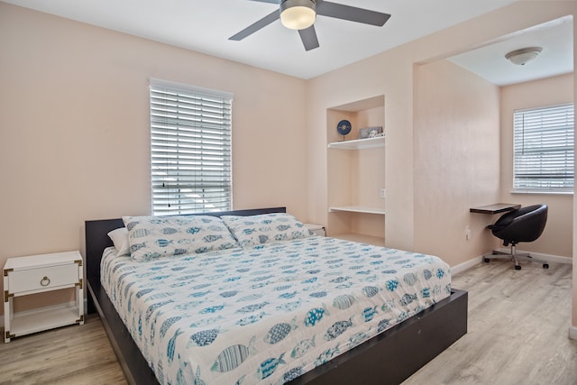 bedroom with ceiling fan and light hardwood / wood-style flooring