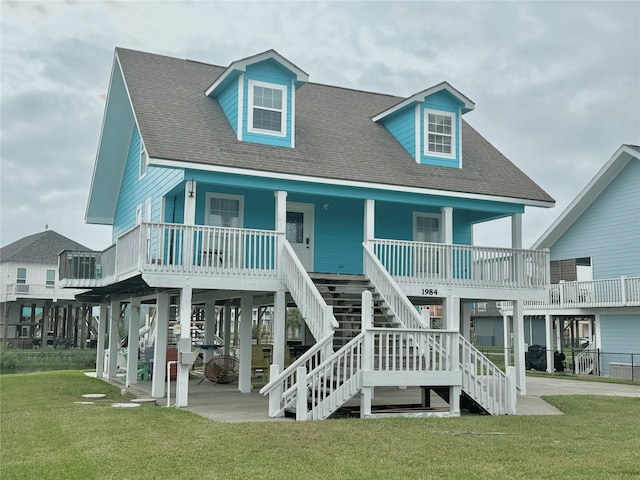 view of front of property with a front yard and a porch