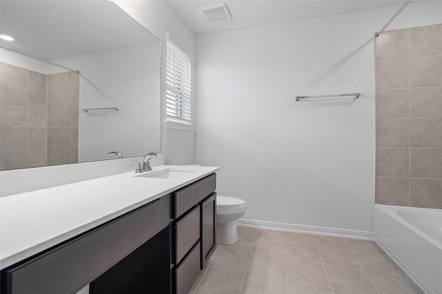 full bathroom featuring tile patterned floors, vanity, tiled shower / bath combo, and toilet