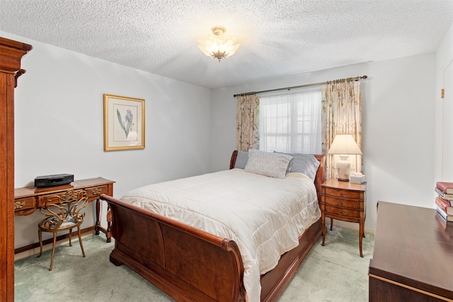 carpeted bedroom with a textured ceiling