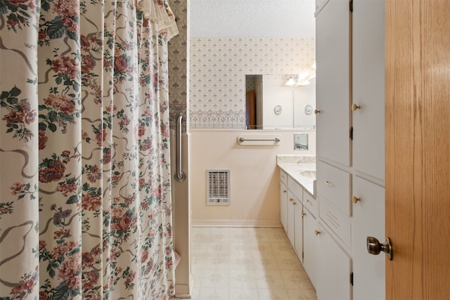 bathroom with vanity and tile floors