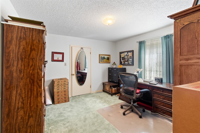 carpeted office with a textured ceiling