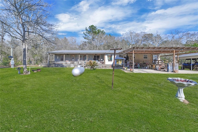 back of house with a patio area, a lawn, and a pergola