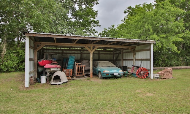 view of outdoor structure with a carport and a lawn