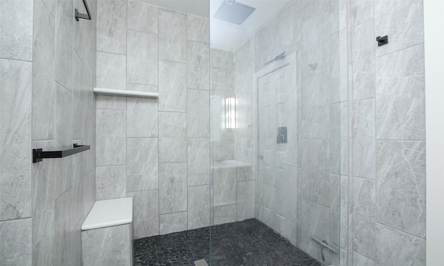 bathroom featuring tiled shower