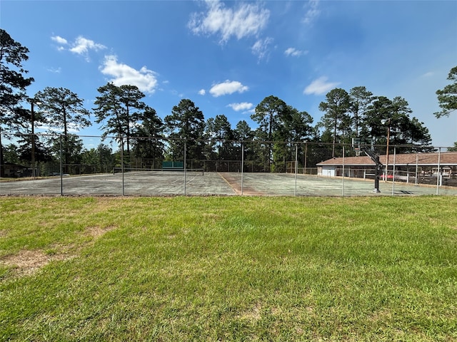 view of yard with tennis court