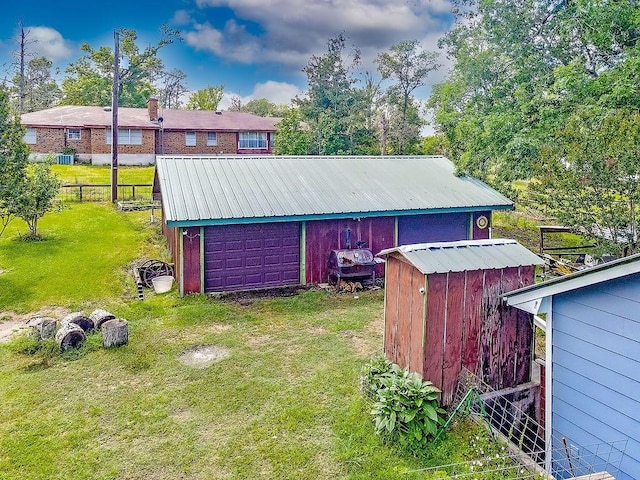 view of outbuilding featuring a yard