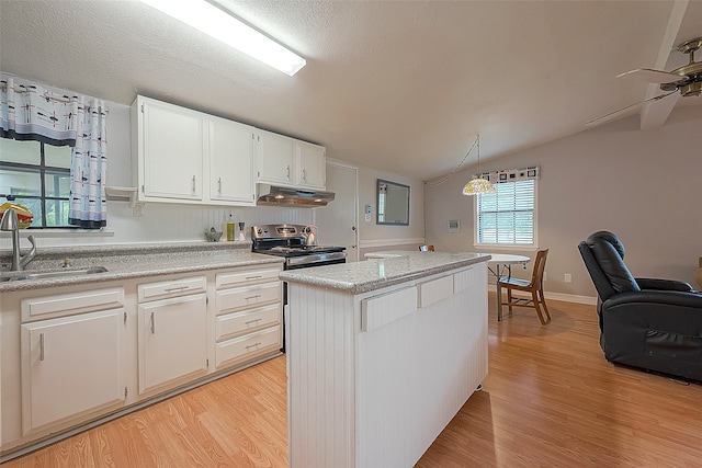 kitchen featuring white cabinetry, light wood-type flooring, lofted ceiling, ceiling fan, and sink