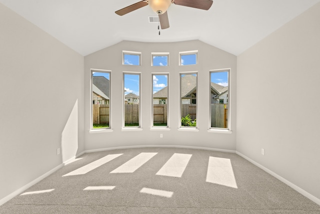 unfurnished room featuring ceiling fan, carpet flooring, and vaulted ceiling