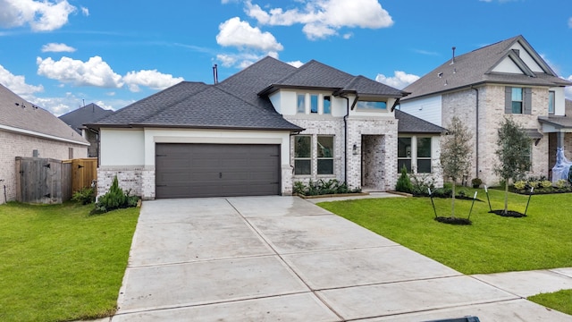 view of front of house with a front yard and a garage