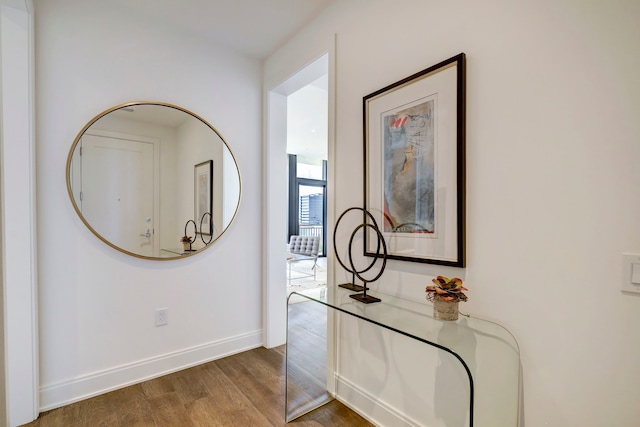 corridor featuring dark hardwood / wood-style floors