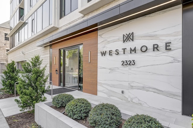 property entrance with brick siding