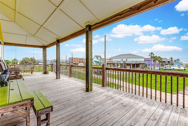 wooden deck featuring a yard