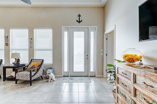 tiled foyer entrance with a high ceiling