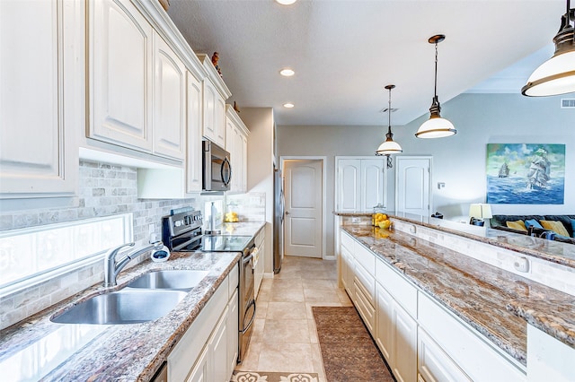 kitchen with light tile floors, sink, backsplash, decorative light fixtures, and stainless steel appliances