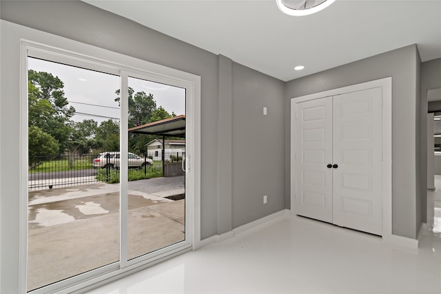 interior space with a healthy amount of sunlight and concrete flooring