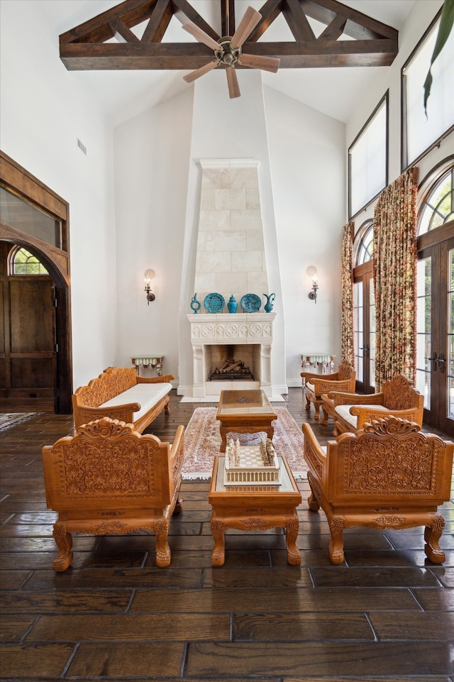 living room with high vaulted ceiling, wood-type flooring, beamed ceiling, and french doors