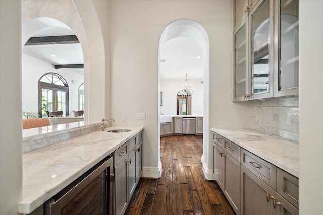 kitchen with wine cooler, sink, tasteful backsplash, beam ceiling, and dark hardwood / wood-style floors