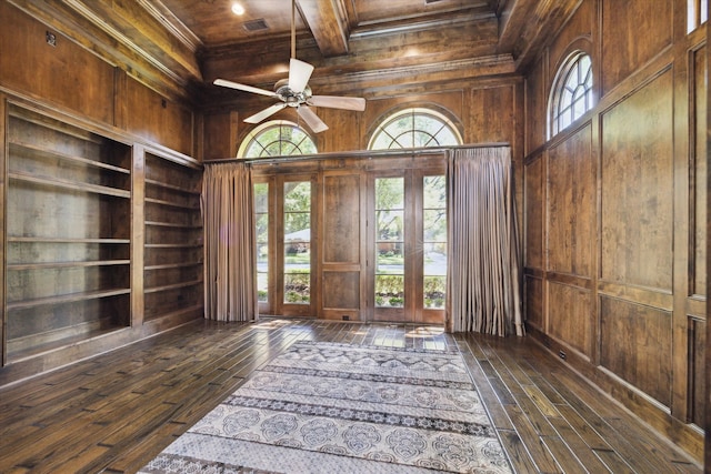 foyer entrance with ceiling fan, coffered ceiling, wooden walls, dark hardwood / wood-style floors, and wooden ceiling