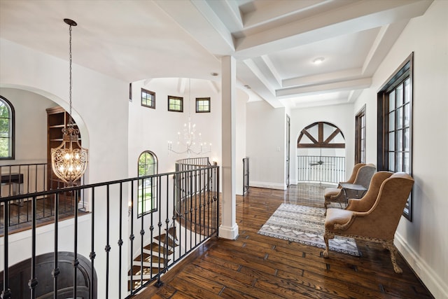 interior space featuring dark hardwood / wood-style flooring and a notable chandelier