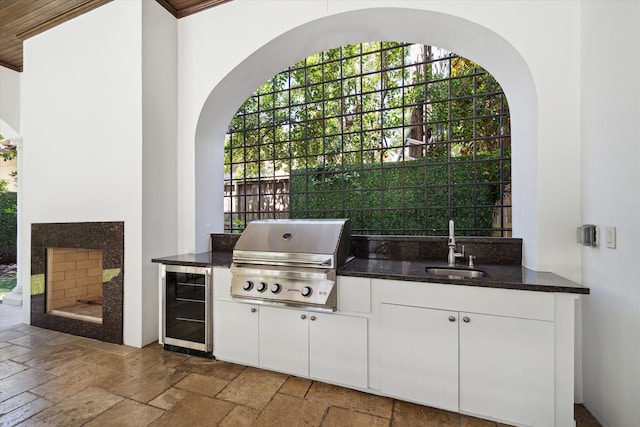 view of patio / terrace featuring a grill, sink, and area for grilling