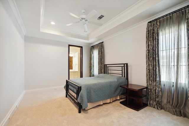 bedroom featuring multiple windows, carpet, crown molding, and a tray ceiling