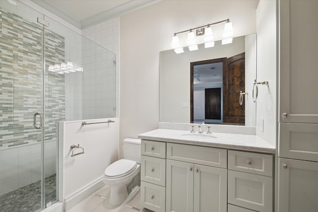 bathroom featuring a shower with door, vanity, toilet, and tile flooring