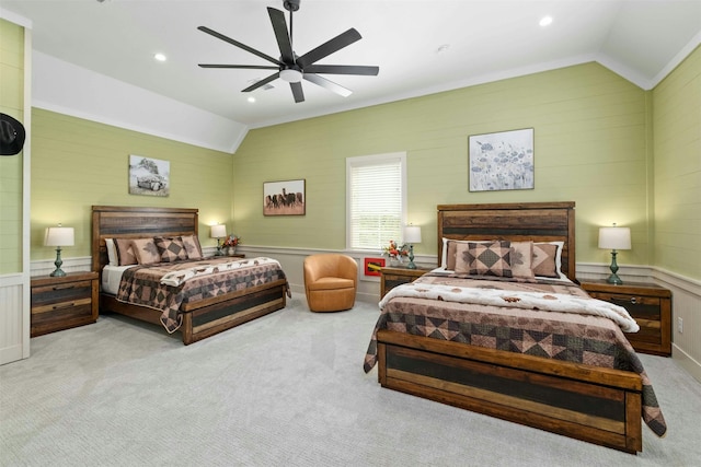 bedroom with light colored carpet, lofted ceiling, and ceiling fan