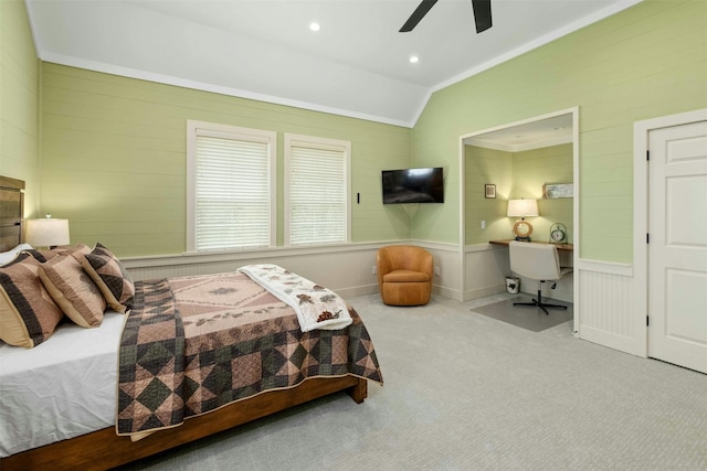 carpeted bedroom featuring crown molding, ceiling fan, and lofted ceiling