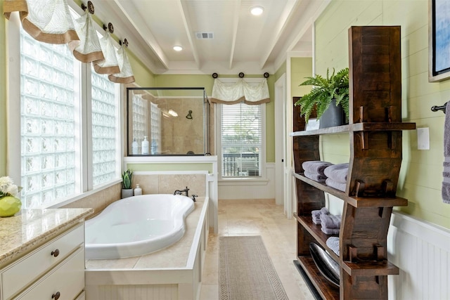 bathroom with independent shower and bath, beam ceiling, and tile floors