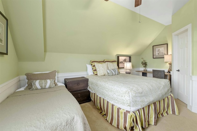 bedroom featuring light colored carpet, lofted ceiling, and ceiling fan