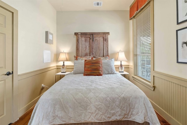 bedroom with a closet and hardwood / wood-style flooring