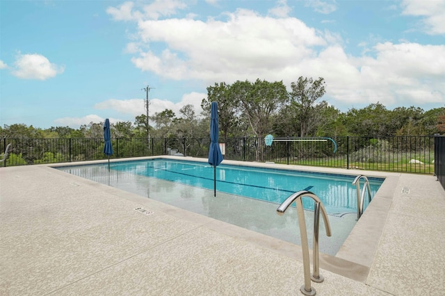 view of swimming pool featuring a patio