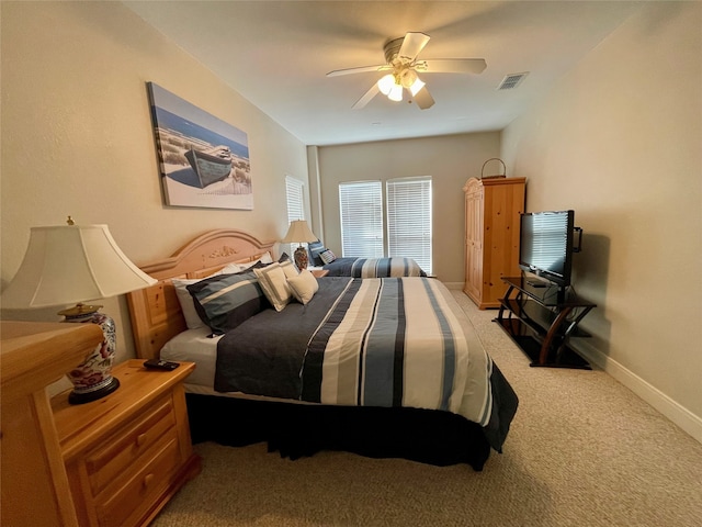 bedroom with light carpet and ceiling fan