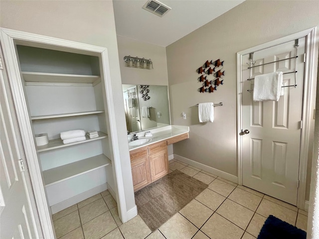 bathroom featuring vanity and tile flooring