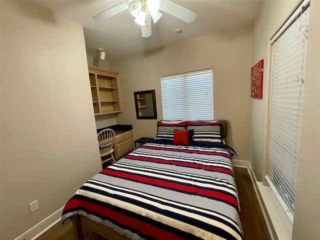 bedroom featuring hardwood / wood-style flooring and ceiling fan