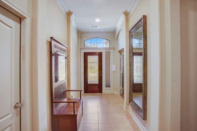 doorway featuring light tile patterned flooring and ornamental molding