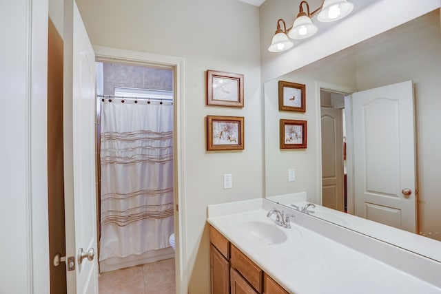 full bathroom featuring tile patterned floors, vanity, toilet, and shower / tub combo with curtain