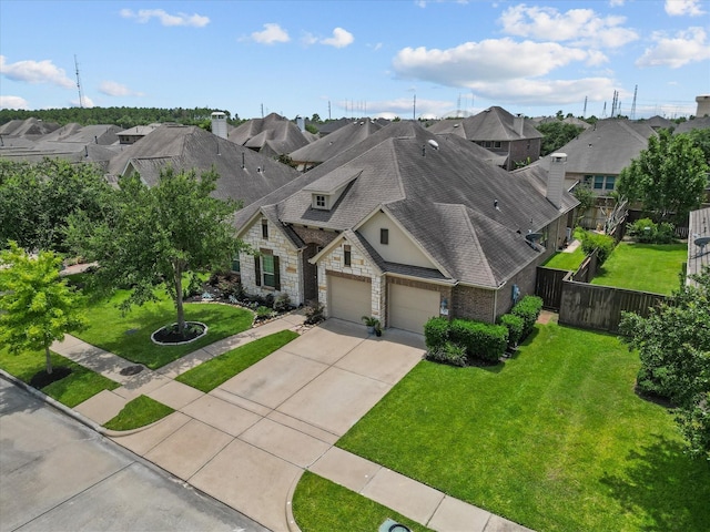 view of front of home with a front yard and a garage