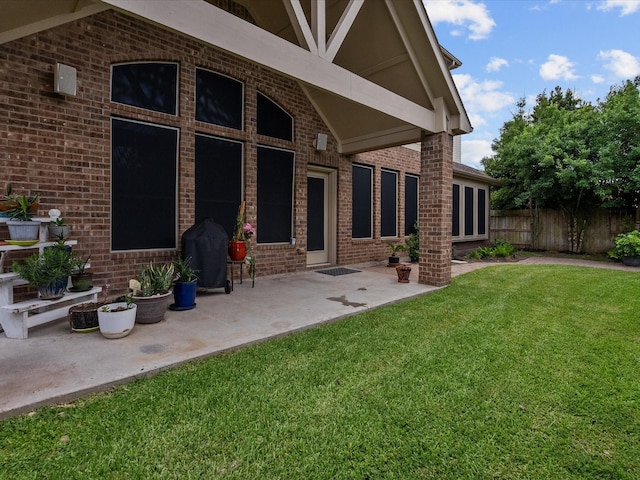 exterior space with a lawn and a patio area