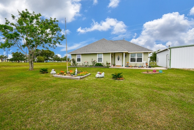 back of property featuring a yard