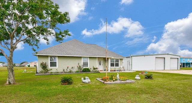 exterior space featuring a garage, a yard, and an outdoor structure