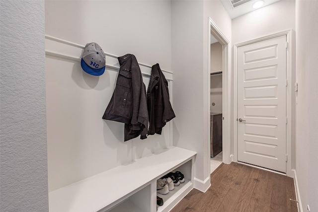 mudroom with dark wood-type flooring