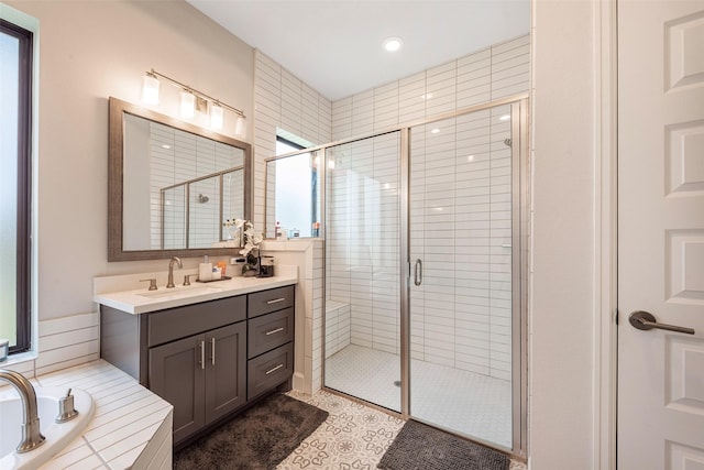 bathroom with vanity, independent shower and bath, and tile patterned flooring