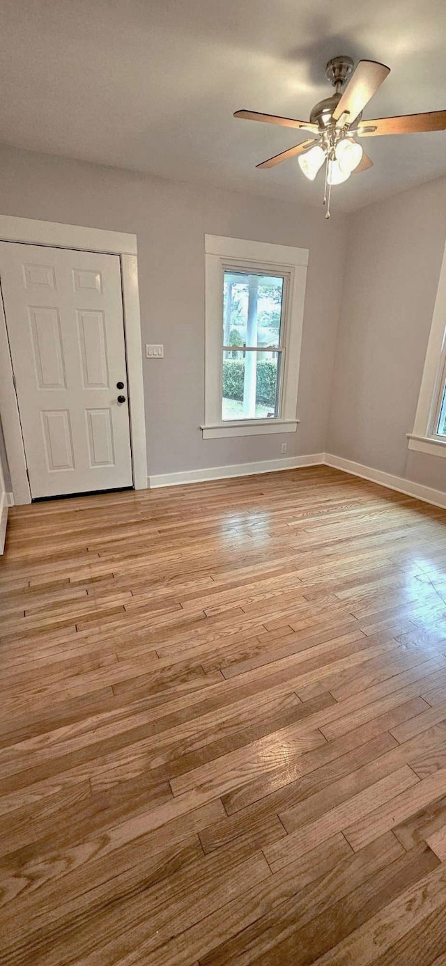 interior space featuring light wood-type flooring and ceiling fan