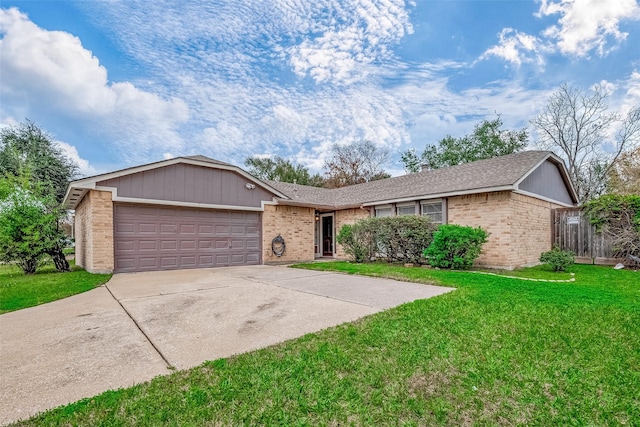 ranch-style home featuring a garage and a front yard