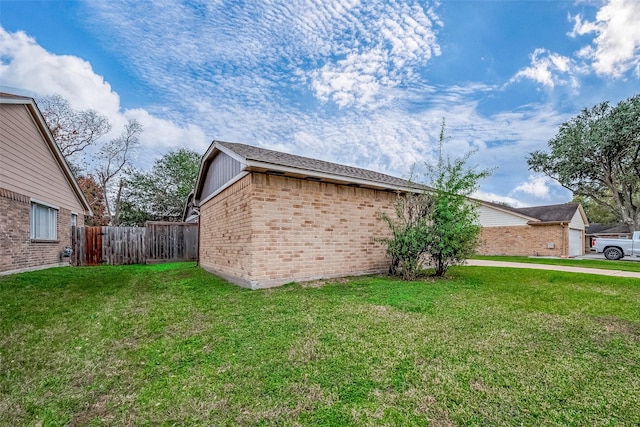 view of property exterior with a lawn