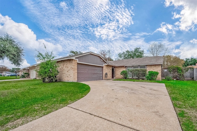 ranch-style house with a front yard and a garage