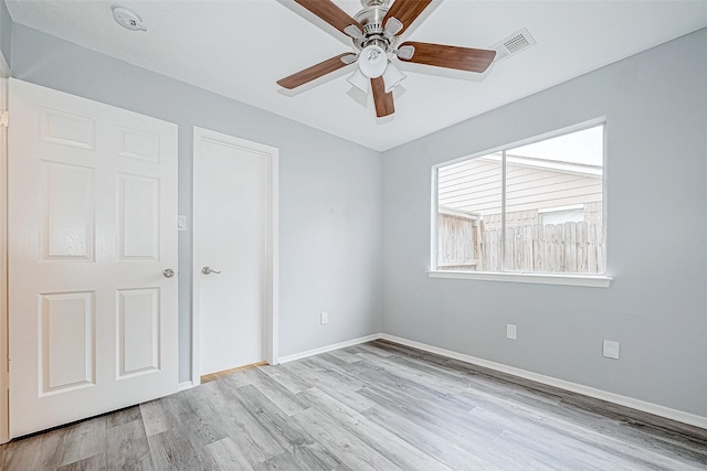 unfurnished bedroom featuring ceiling fan and light wood-type flooring